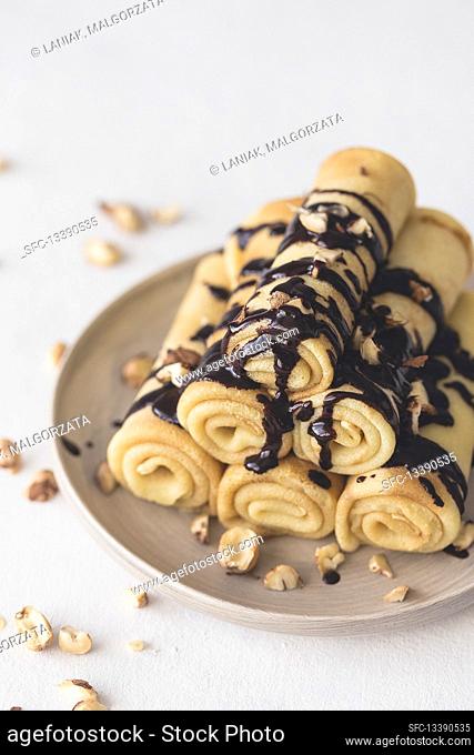Crepes with chocolate sauce and hazelnuts