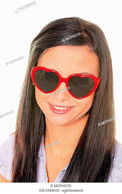 Young woman with heart-shaped sunglasses - 01/01/2011