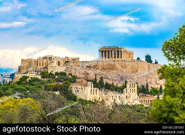 Acropolis of Athens on hill with amazing and beautiful ruins Parthenon and blue cloudy sky in Greece's capital Athens in Greece