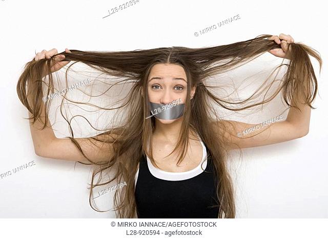 Woman with Tape Over Mouth