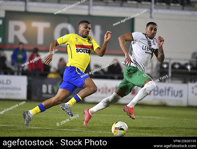 Westerlo's Lyle Foster and Virton's Nicholas Rizzo fight for the ball during a soccer match between Royal Excelsior Virton and KVC Westerlo