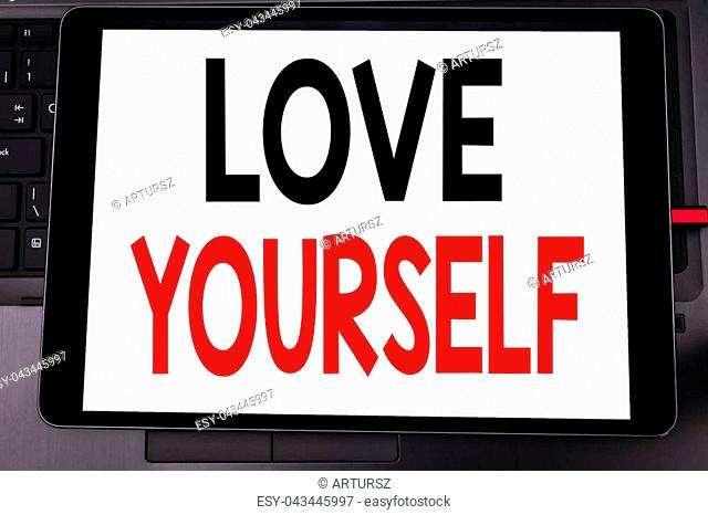 Conceptual hand writing text caption inspiration showing Love Yourself. Business concept for Positive Slogan For You written on tablet laptop on black keyboard...