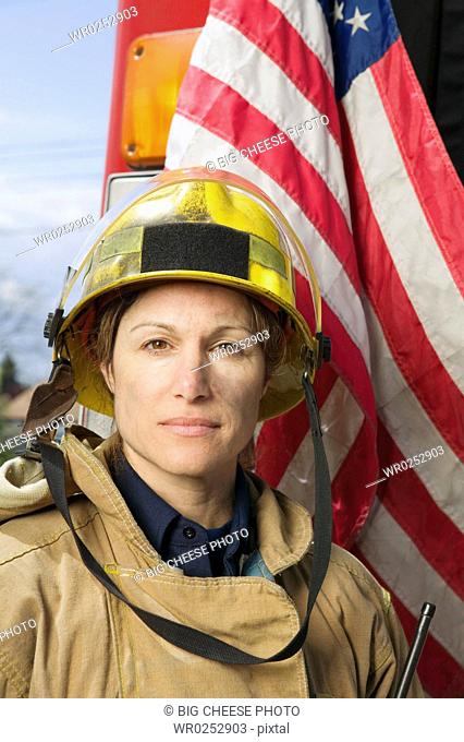 Female firefighter with American flag