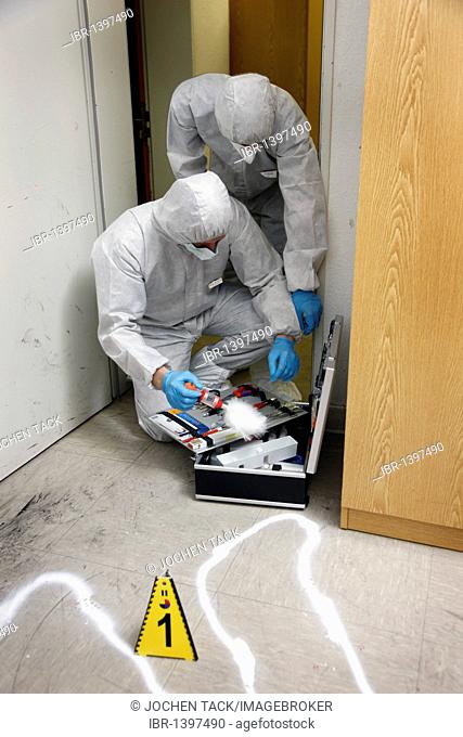 Forensic's case, officers of the C.I.D., the Criminal Investigation Department, gathering forensic evidence at the scene of a crime, after a capital offence