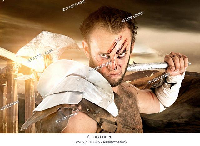 Ancient warrior or Gladiator posing outdoors with axe