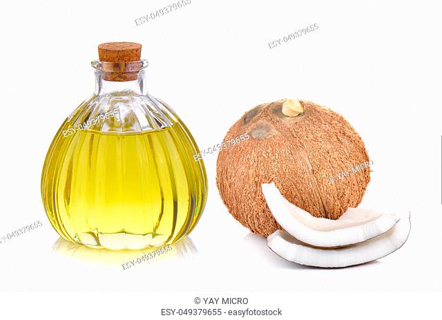 oil bottle and coconut on a white background