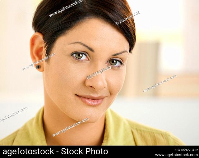 Closeup portrait of attractive young woman, smiling