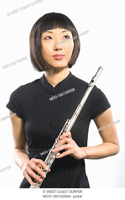 Young Korean woman holds flute