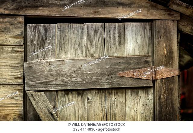 detail of sagging wooden door