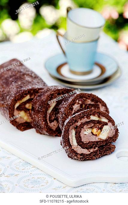 Chocolate Swiss roll with bananas and hazelnuts