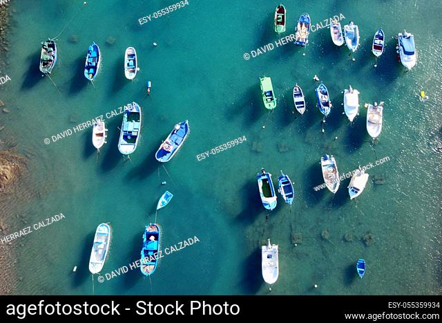 Aerial view of little fishing colorful boats in Tajao, Tenerife, Canary Islands. High quality photo