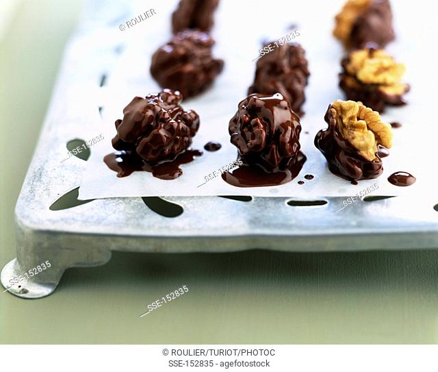 Walnuts coated with melted chocolate