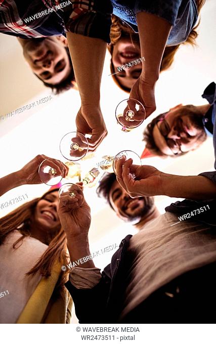 Low angle view of business people toasting drink