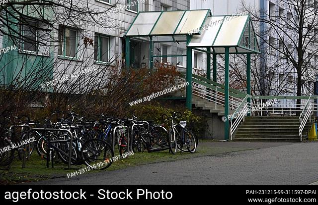 PRODUCTION - 14 December 2023, Saxony, Leipzig: Several bicycles are parked in front of the entrance to a student hall of residence on Straße des 18