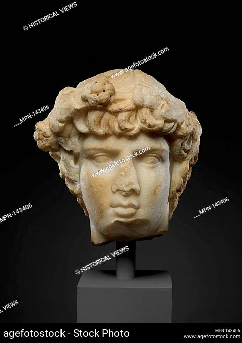 Marble portrait head of Antinoos. Period: Late Hadrianic; Date: ca. A.D. 130-138; Culture: Roman; Medium: Marble; Dimensions: Overall: 9 1/2 x 8 1/4 in