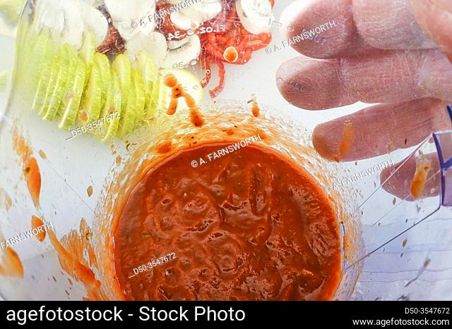Pizza sauce in a jar and sliced vegetables
