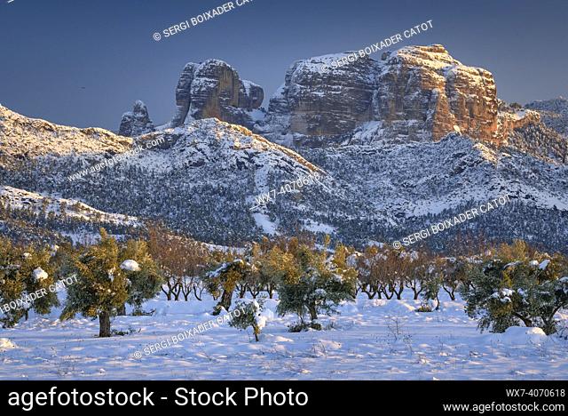 Roques de Benet rocks, near Horta de Sant Joan, in a winter snowy sunset after a heavy snowfall (Terra Alta, Tarragona, Catalonia, Spain)