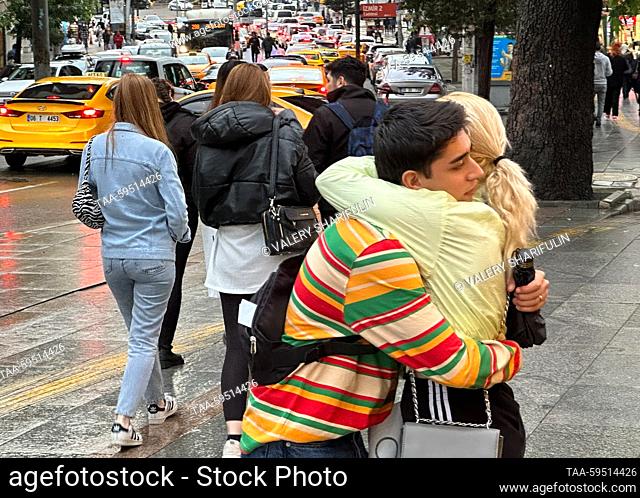 TURKEY, ANKARA - MAY 30, 2023: A young couple hug in a congested street. Valery Sharifulin/TASS