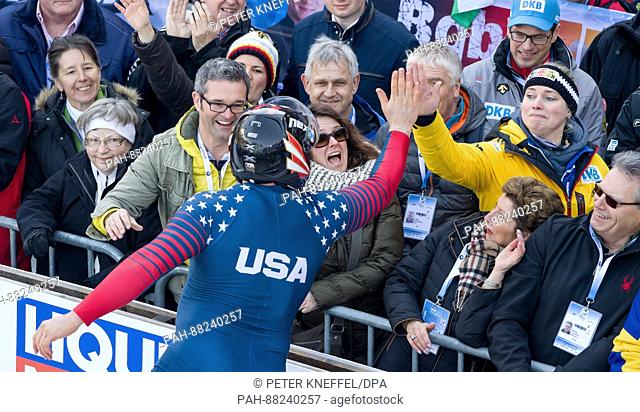 Bobsleigh athletes Steven Holcomb from the USA claps hands Francesco in Schoenau am Koengissee on 19 February 2017. Holcomb made 7th place