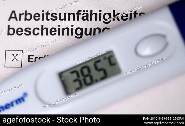 19 October 2020, Baden-Wuerttemberg, Stuttgart: ILLUSTRATION - A fever thermometer is placed on a certificate of incapacity for work (scene provided)
