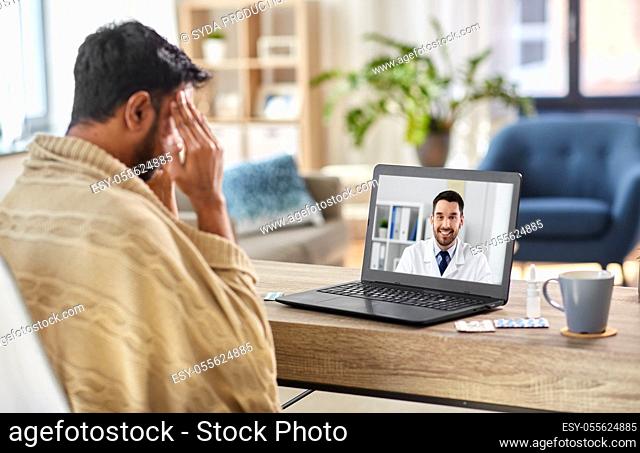 sick man having video call with doctor at home