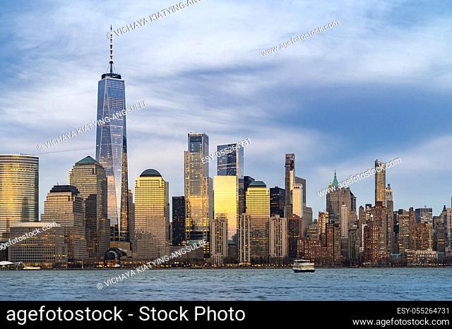 New York city NYC Lower Manhattan Skyscraper skylines building cityscape sunset at dusk from New Jersey. Lower Manhattan is the largest financial district in...