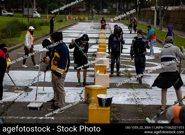 People gather and paint a mural on June 11, 2021. In front of the Attorney General's Office, in Bogotá Colombia to show their dissatisfaction for the...