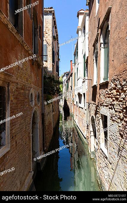 View of a typical stream of the Venetian lagoon. Venice (Italy), May 31th, 2021