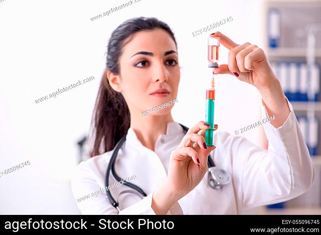 Young female doctor in infusion concept