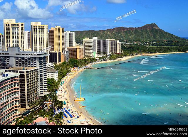 An aerial view of the crowd and hotels along Waikiki Beach in Hawaii