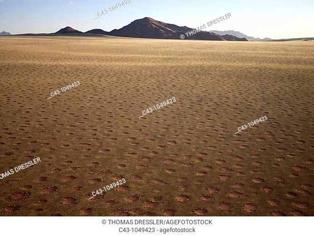 Namibia - Aerial view of grass-grown desert plain and isolated mountain ridges at the edge of the Namib Desert  In March during the rainy season with a delicate...