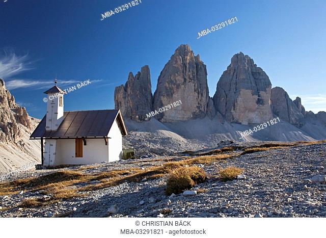 Drei Zinnen mountains with chapel of the Drei Zinnen hut, Sexten Dolomites, South Tirol, Northern Italy, Italy