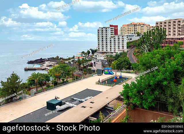 Funchal at Madeira, Portugal - July 31, 2014: Modern hotels with playground near Atlantic coast of Madeira