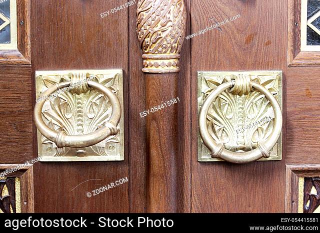 two gold plated rings on the outer doors of the Naval Cathedral of St. Nicholas, Kronstadt