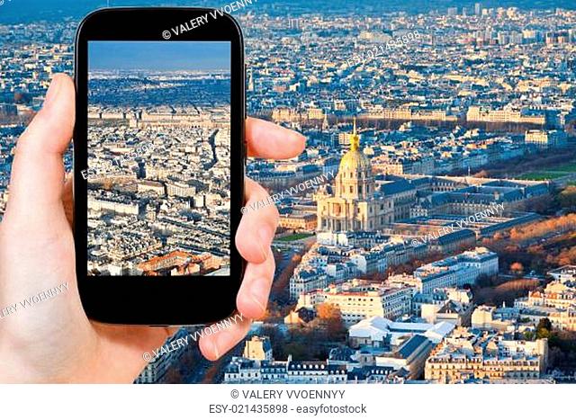 tourist taking photo of Paris panorama