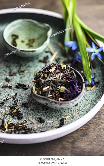 Floral tea with scilla flowers on rustic background
