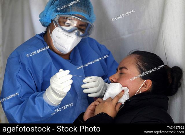MEXICO CITY, MEXICO - AUGUST 10: A woman undergoes a rapid test in a Health Kiosk, to detect Sars Cov-2 that causes Covid-19 disease