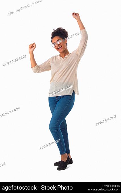 Full length portrait of african american mixed race woman keeping her arms raised isolated on white background, casual people
