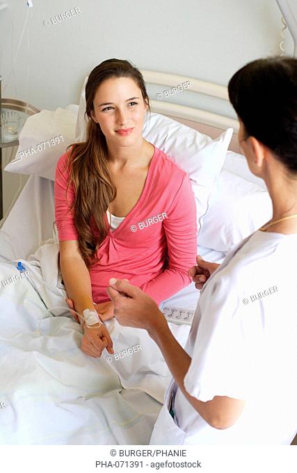 Nurse talking with a patient at hospital