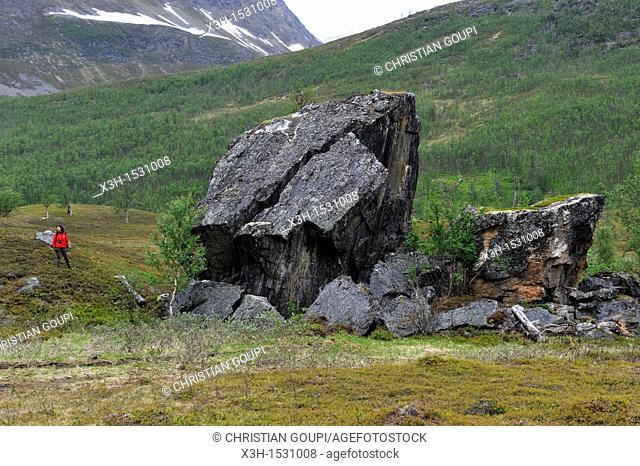 isolated huge rock in Nordmannvikdalen valleycalled Church Rock in reference to Sami people mythology, region of Lyngen, County of Troms, Norway