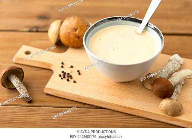 mushroom cream soup in bowl on cutting board