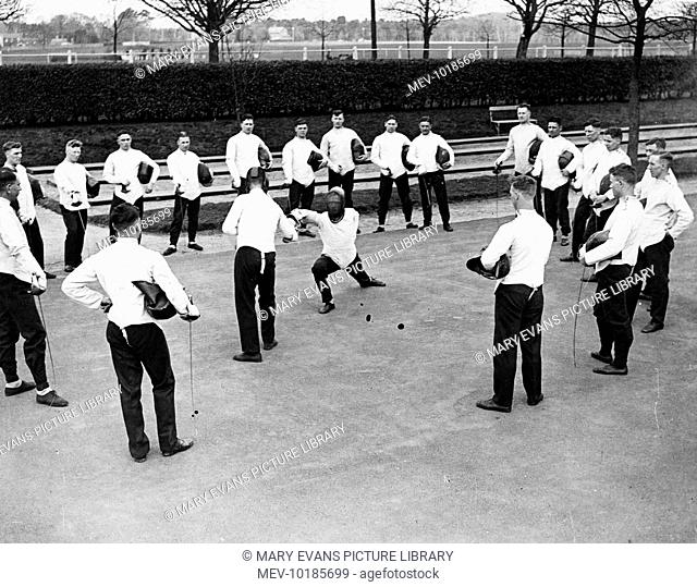 Young army cadets at Aldershot Barracks, Hampshire, England, enjoying a fencing lesson
