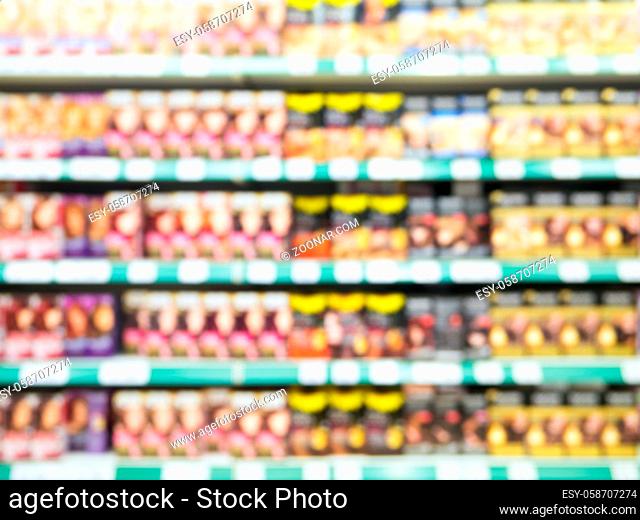 Abstract blurred supermarket colorful shelves with hair-dye as background