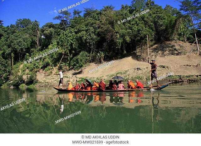 Traditional boats are a common mode of transportation through the Sangu river Thanchi in Bandarban, Bangladesh December 2, 2009