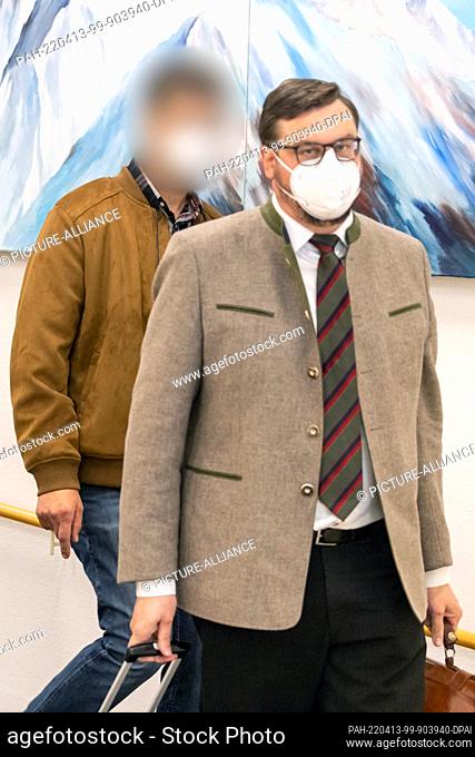 13 April 2022, Bavaria, Ansbach: An accused farmer (l) arrives at Ansbach District Court with his lawyer Marc Zenner for the start of the trial