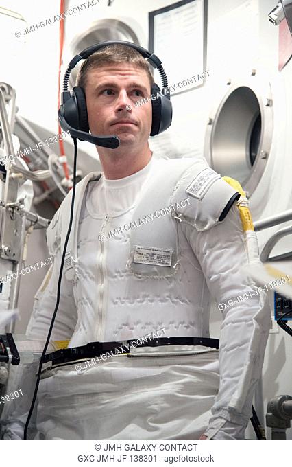 NASA astronaut Reid Wiseman, Expedition 4041 flight engineer, participates in an Extravehicular Mobility Unit (EMU) spacesuit fit check in the Space Station...