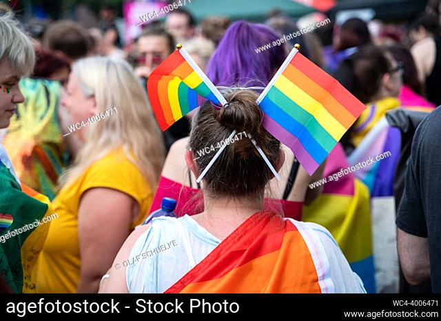 Berlin, Germany, Europe - A female participant with colourful little rainbow flags in her hair at the Christopher Street Day (CSD) parade