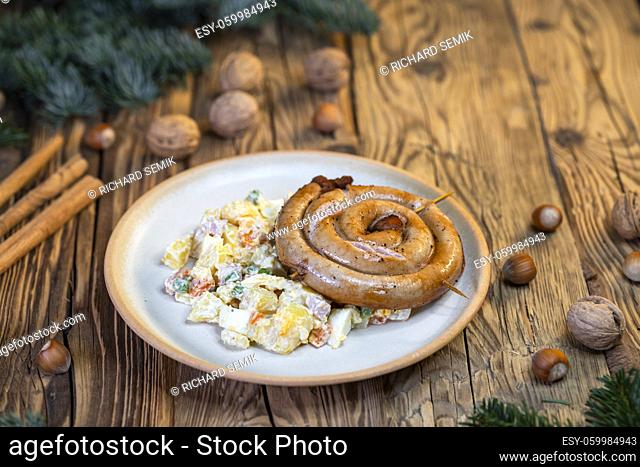 Traditional Christmas food in Czech Republic - white sausage with potato salad