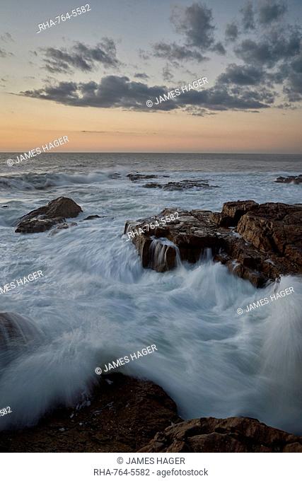 Surf along the rocky coast at sunset, Elands Bay, South Africa, Africa