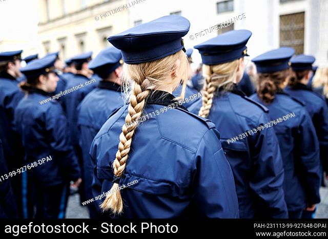 09 November 2023, Bavaria, Munich: Policewomen of the Bavarian police stand in police uniform in an honor formation. Photo: Matthias Balk/dpa